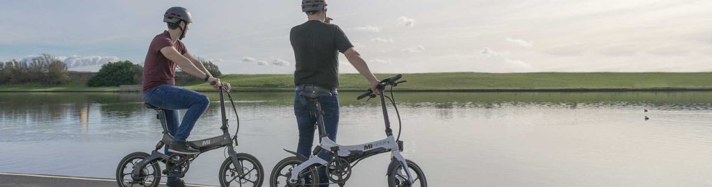 two people enjoying their electric folding bikes